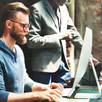 Business Team working together on a mac